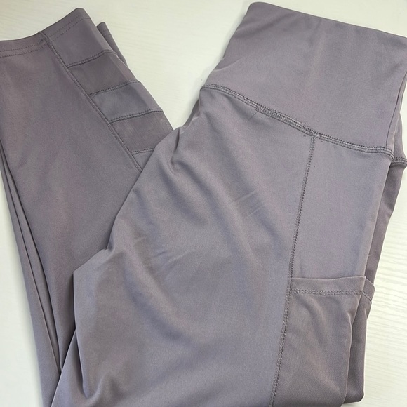 Washed but never worn purple capri leggins with mesh sides